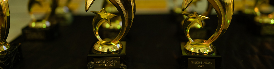 close up photo of hope star awards gold trophies